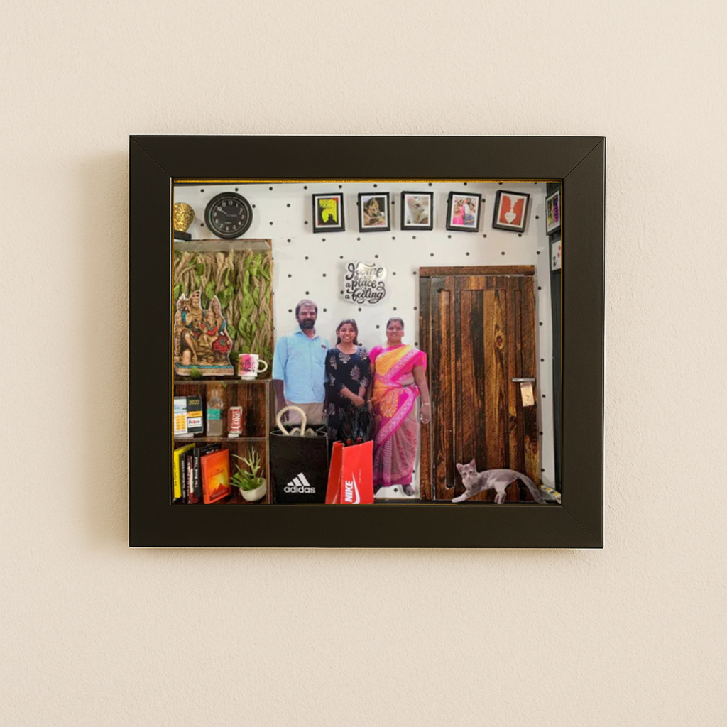A framed photo shows three people smiling in a cozy room with colorful decor. A cat sits nearby. The scene feels warm and welcoming.