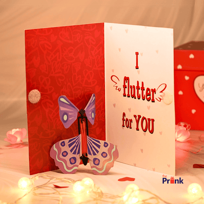 A romantic greeting card with a butterfly design inside says 