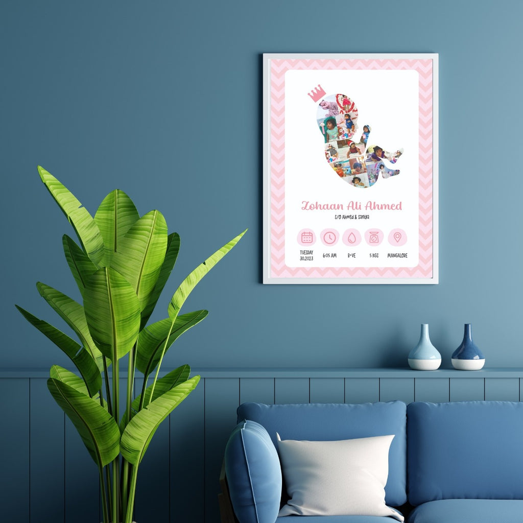 A framed baby announcement photo on a blue wall shows a baby silhouette with photos inside. A plant and blue couch with cushions are nearby. Tone is cozy and welcoming.