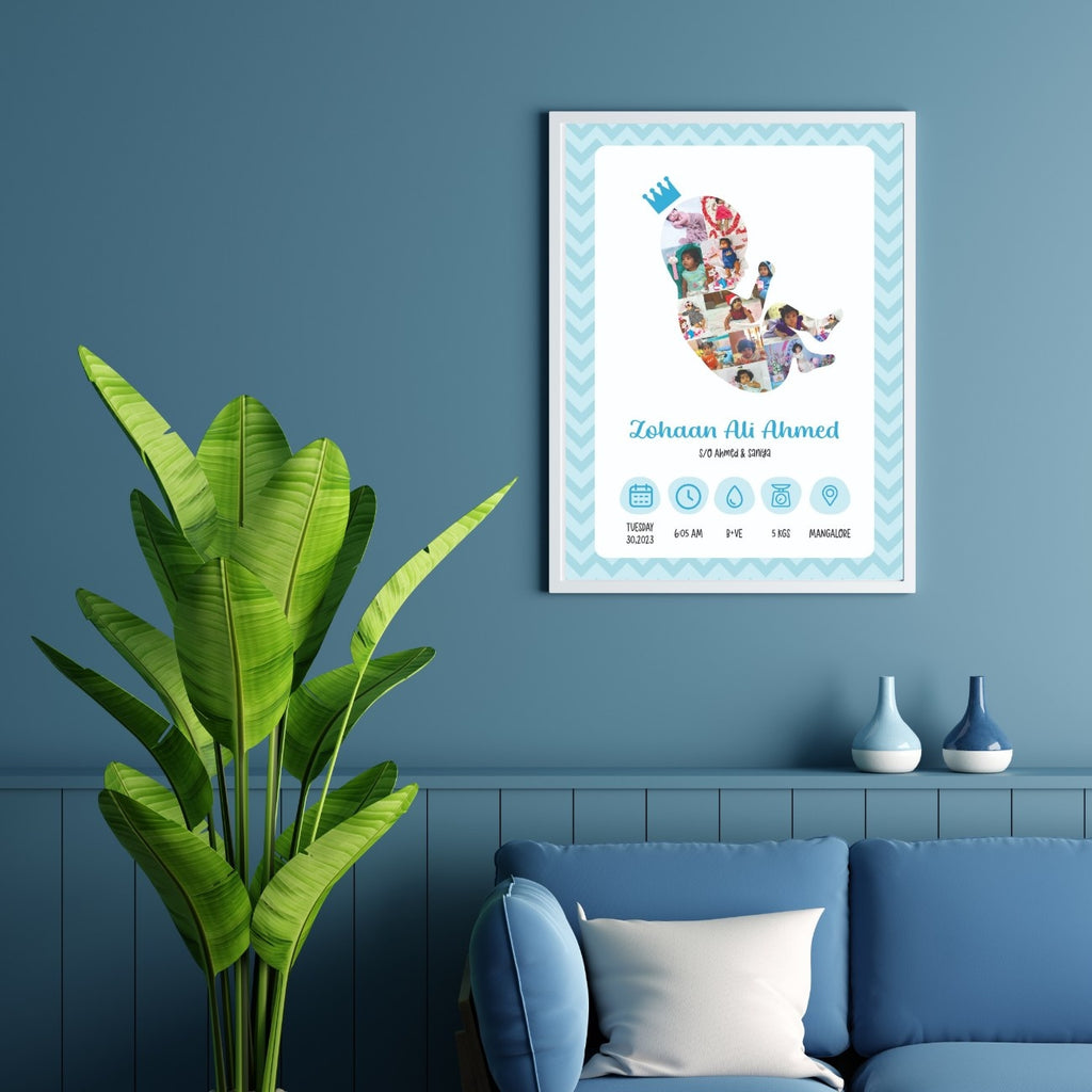 A framed baby announcement photo on a blue wall shows a baby silhouette with photos inside. A plant and blue couch with cushions are nearby. Tone is cozy and welcoming.