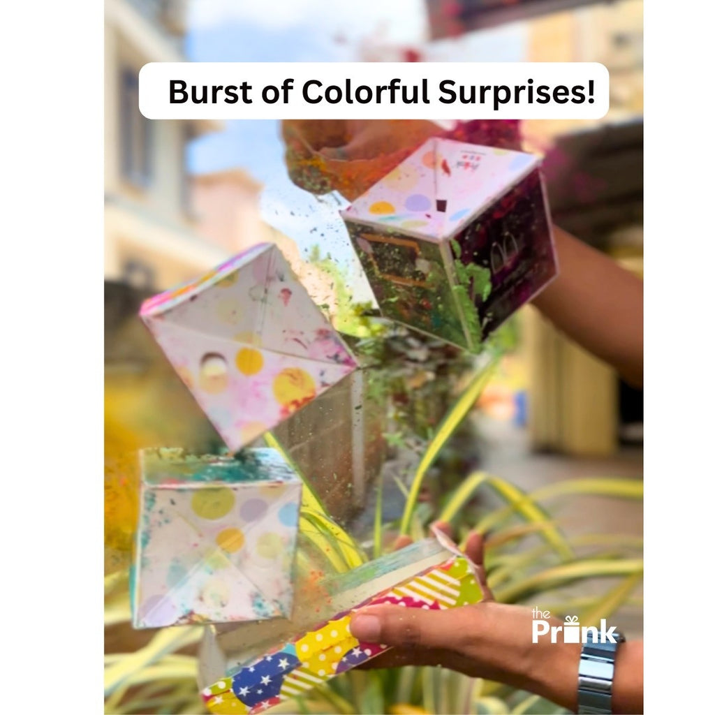 A person holds a colorful, confetti & colour filled cube that is bursting open. Vibrant colors and energetic motion convey excitement and surprise.