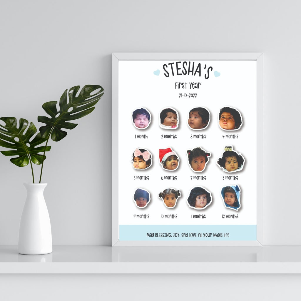 Framed collage of twelve baby milestone photos for each month of the first year. Decorated with hearts, placed on a white shelf beside a leafy plant.