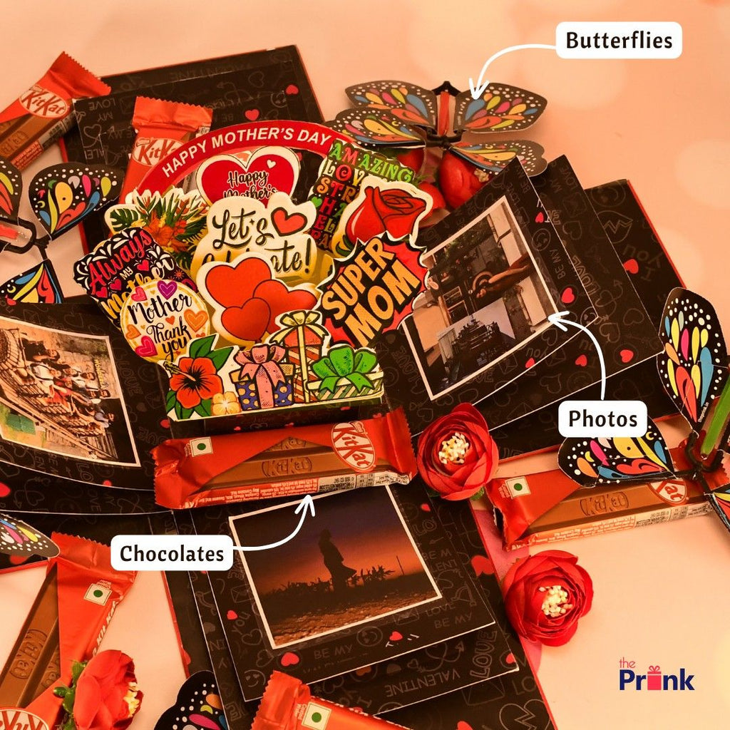 A colorful Mother's Day-themed gift box with vibrant butterflies, assorted chocolates, and heartfelt stickers reading "Super Mom." Photos are nestled among the decorations, conveying warmth and appreciation.
