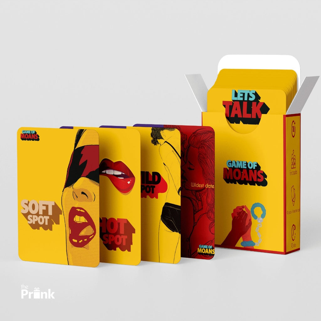 Yellow box with “Game of Moans” card game. Cards show bold graphics and words like “Soft Spot” and “Hot Spot.” Energetic, playful design.